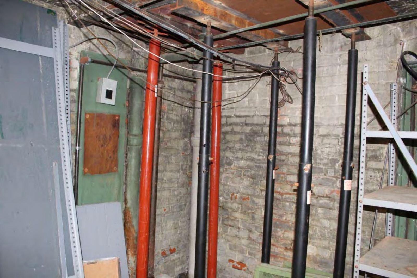 Floor jacks supporting the separating south wall in the basement.