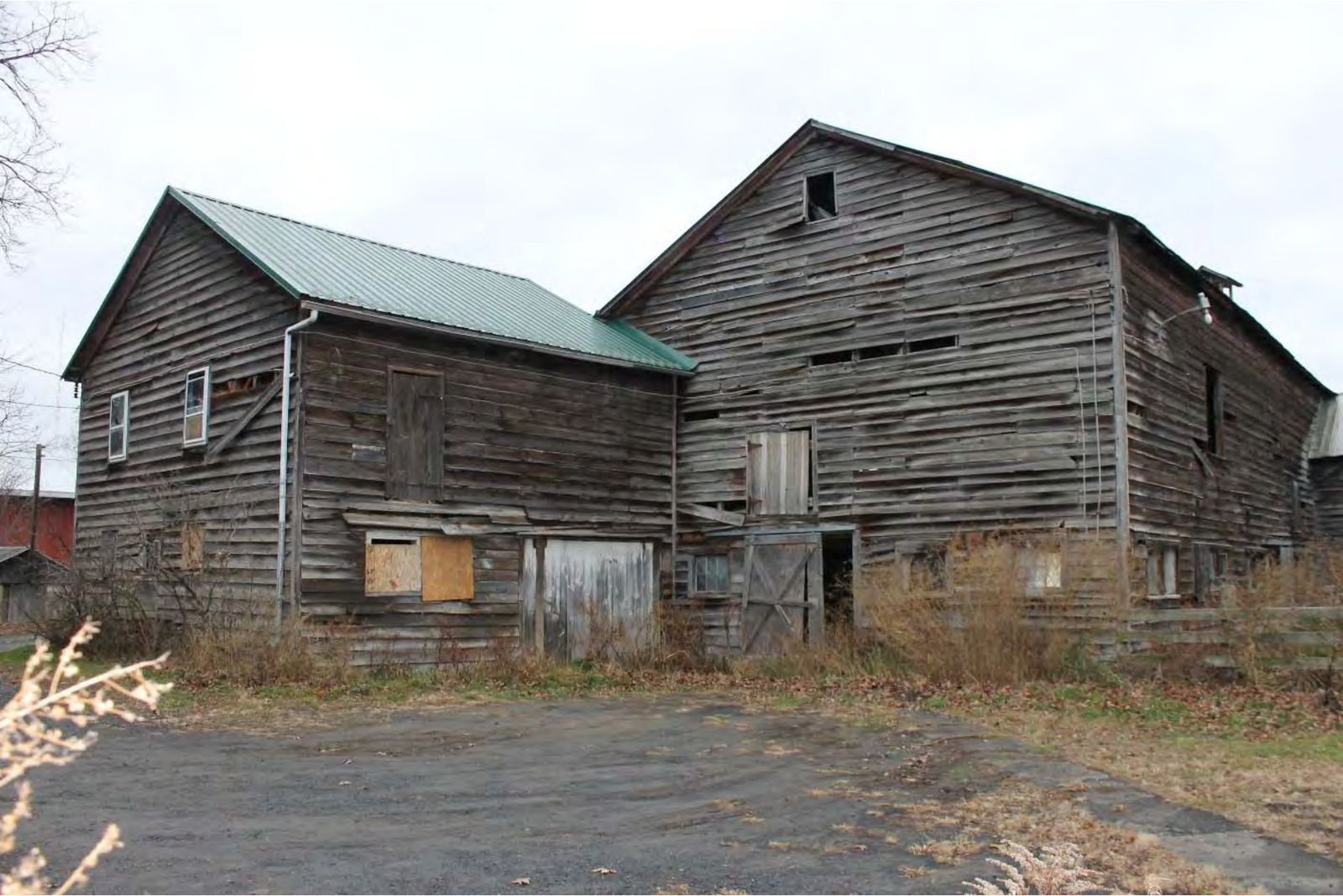 Horse barn (left) and the original main barn (right).
