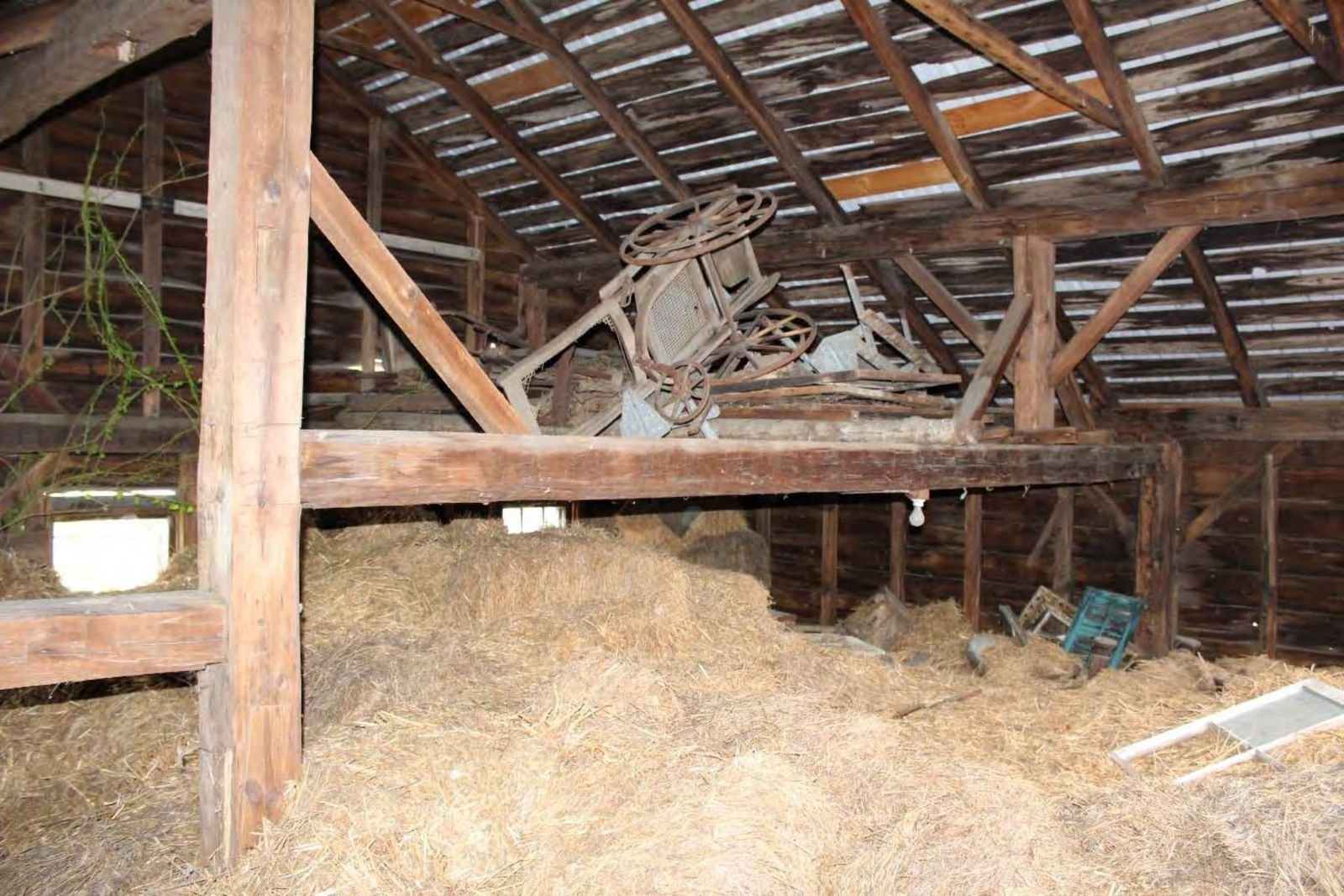 Asymmetrical framing and partial H-bent in the horse barn loft.