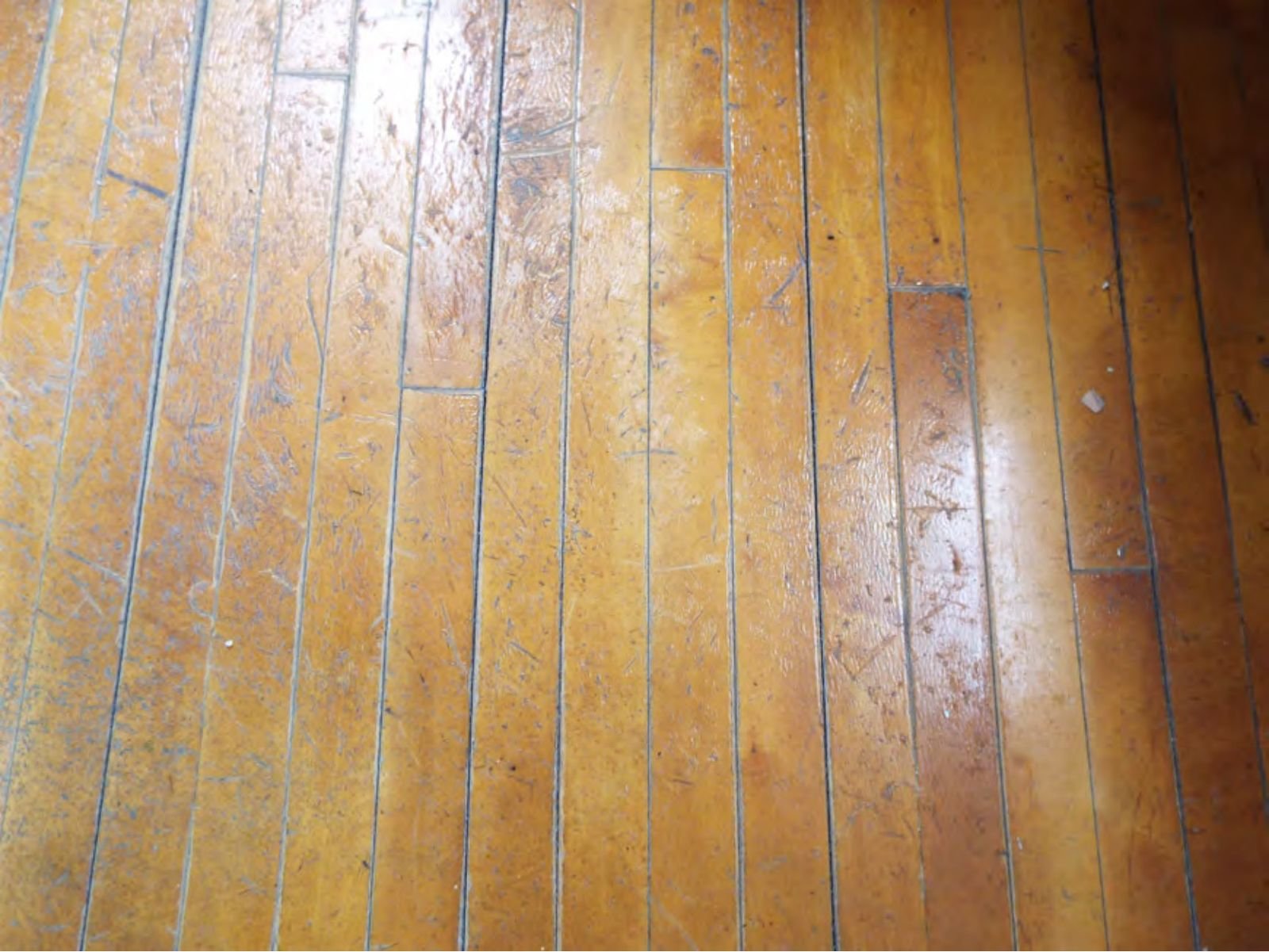 Original narrow-plank hardwood floor on the second floor.