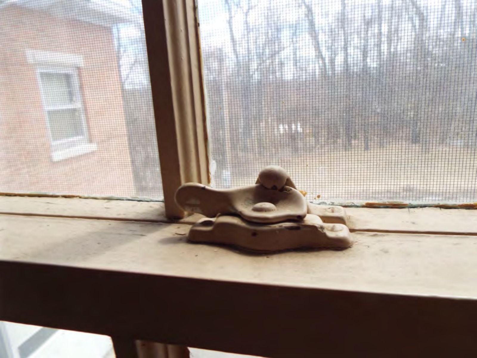 Original window hardware and sash on the second floor.