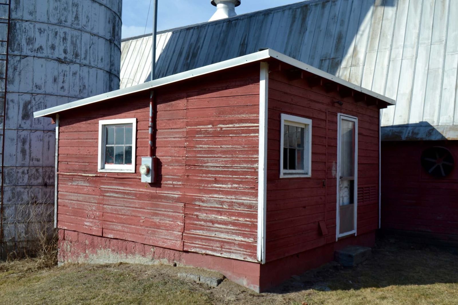 The milk house, facing northwest.