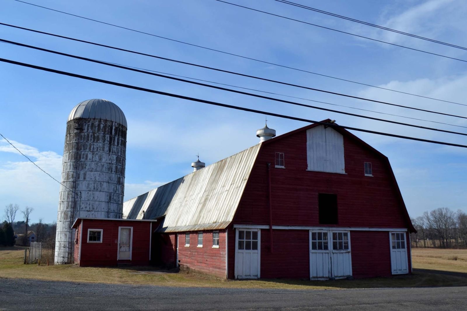 The main barn, milk house and silos together, facing northwest.